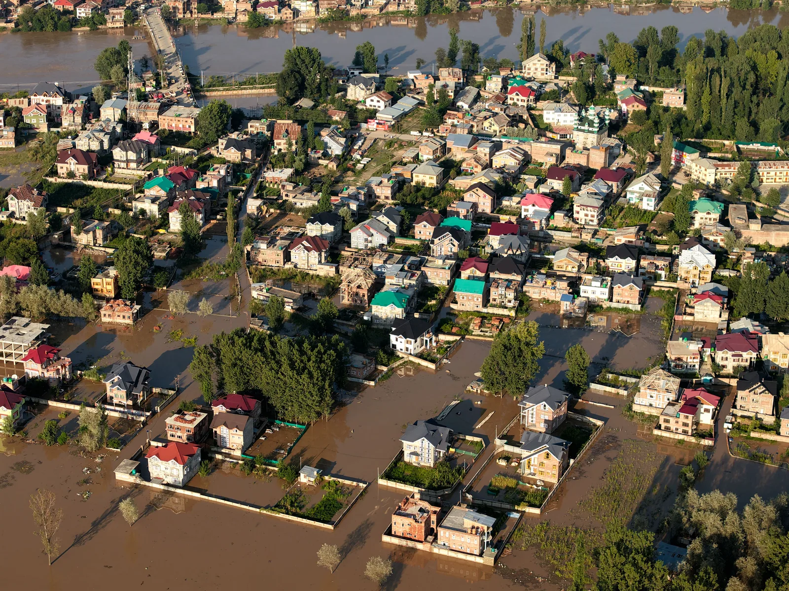 Aerial view showing extensive flooding in an urban area of Kashmir, India. Do Ontario, Quebec, BC and Alberta Require a Water Damage Restoration License?